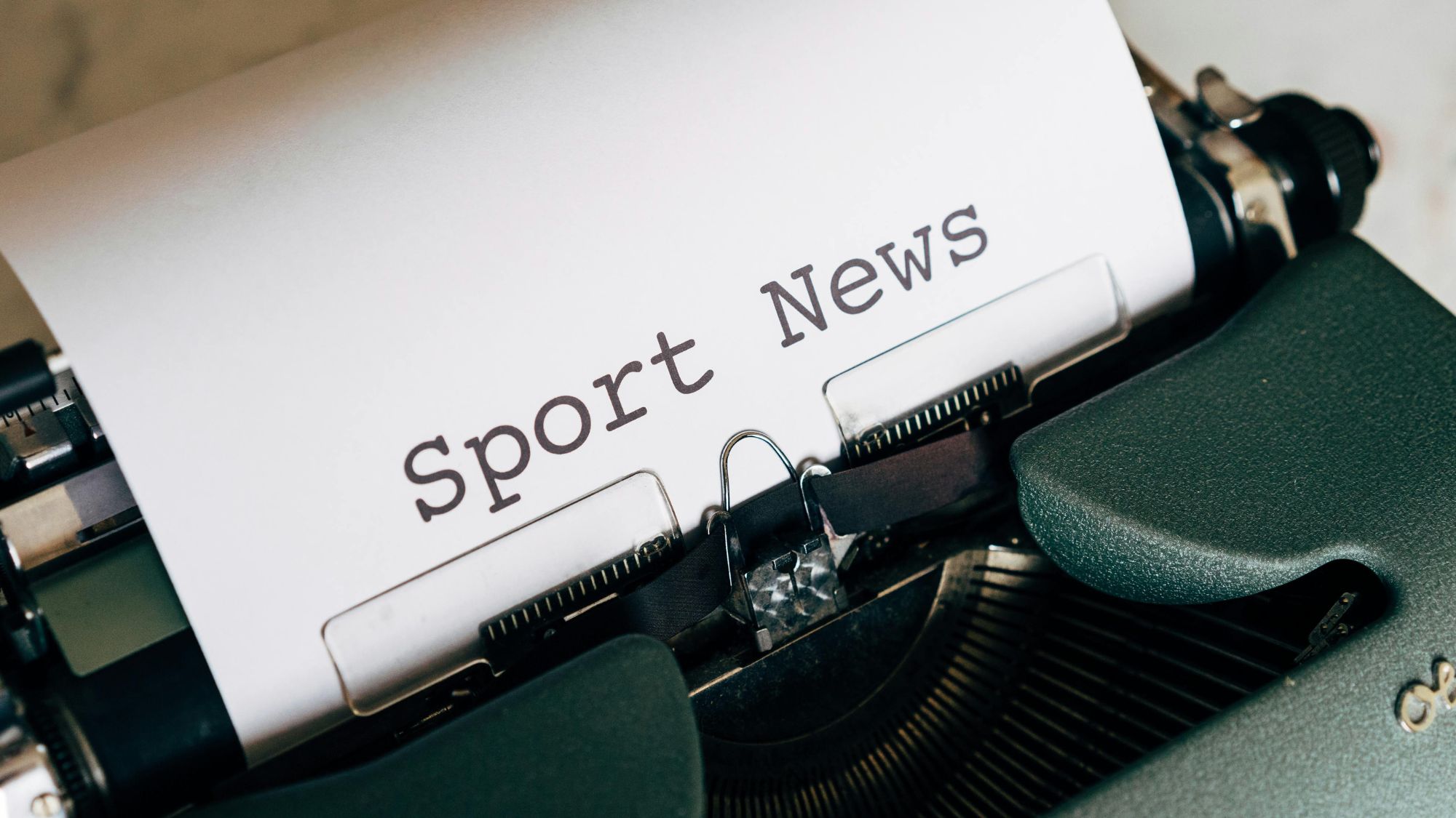 A typewriter typing the international sports news