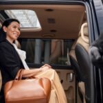 A woman is waiting in the pre-booked Heathrow airport transfer service