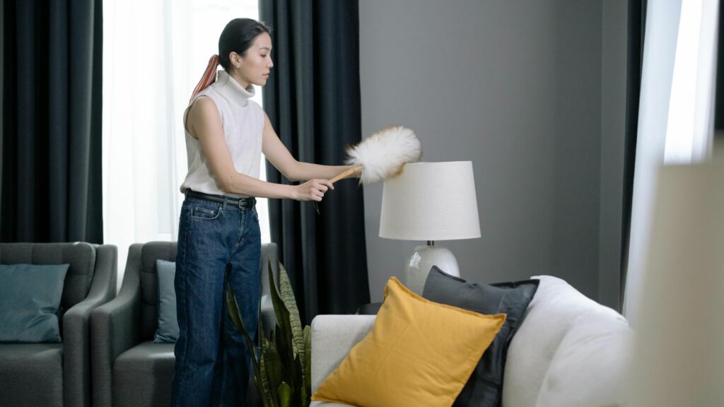 A woman trying to how to remove stains and maintain her sofa’s upholstery