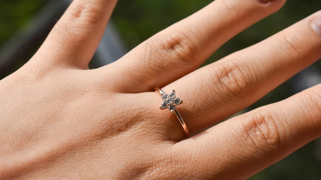 A woman wearing a diamond ring made by a leading jewelry manufacturers